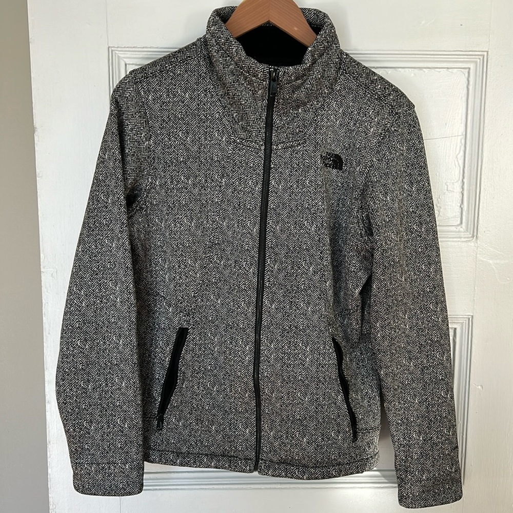 The North Face black and white herringbone zip up, fleece lined jacket